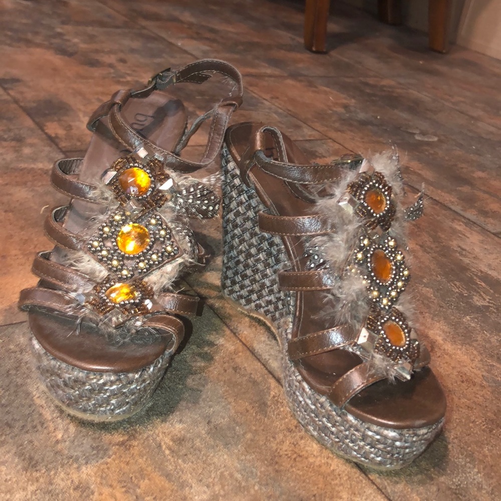 bucco wedges with feather and amber stone accents